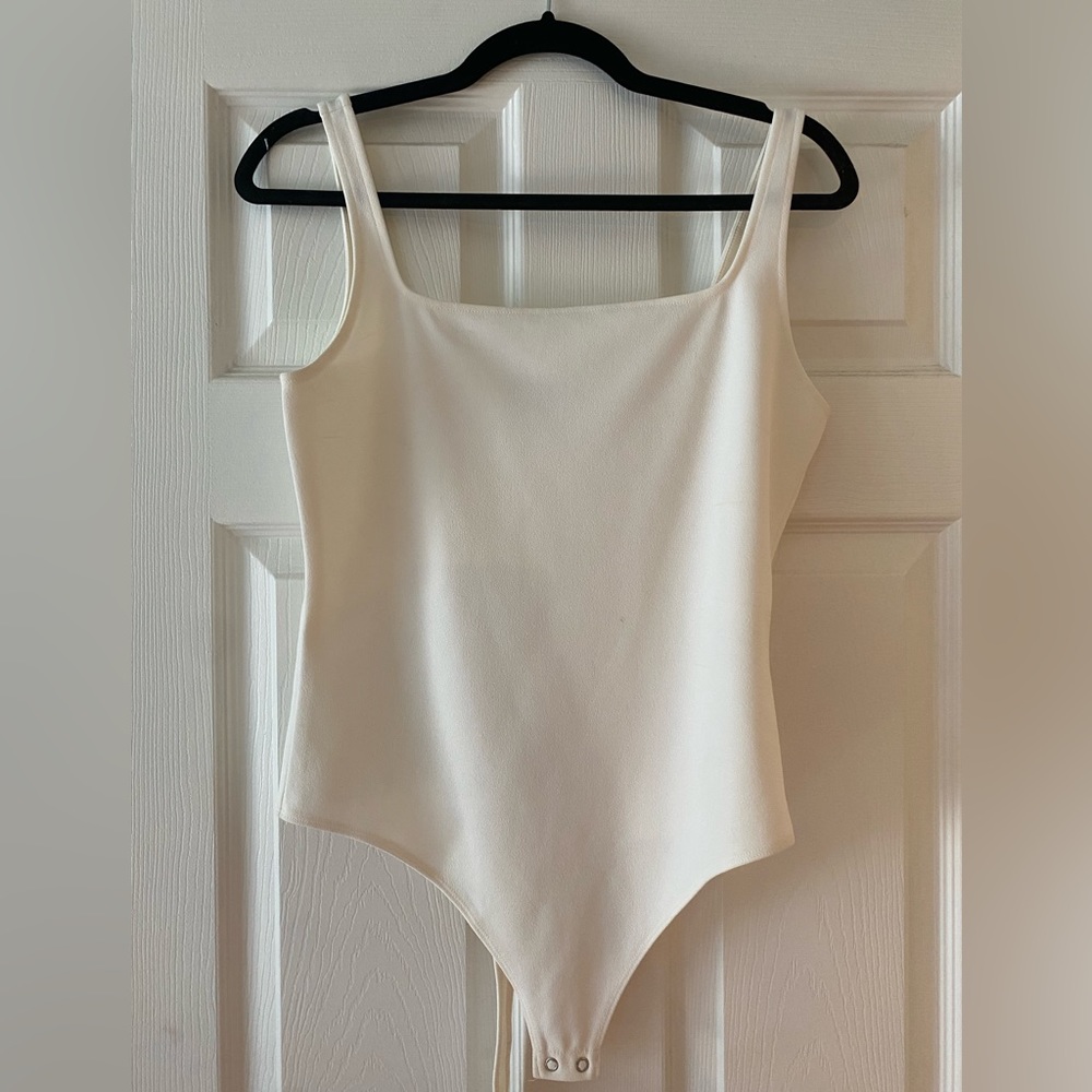 Cream Express thong bodysuit